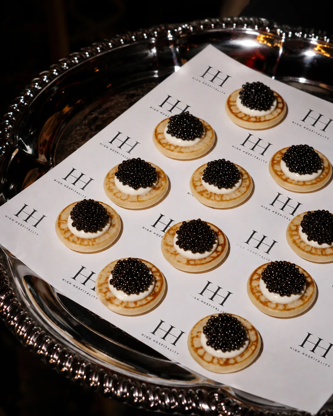 Caviar bites on a branded High Hospitality serving tray